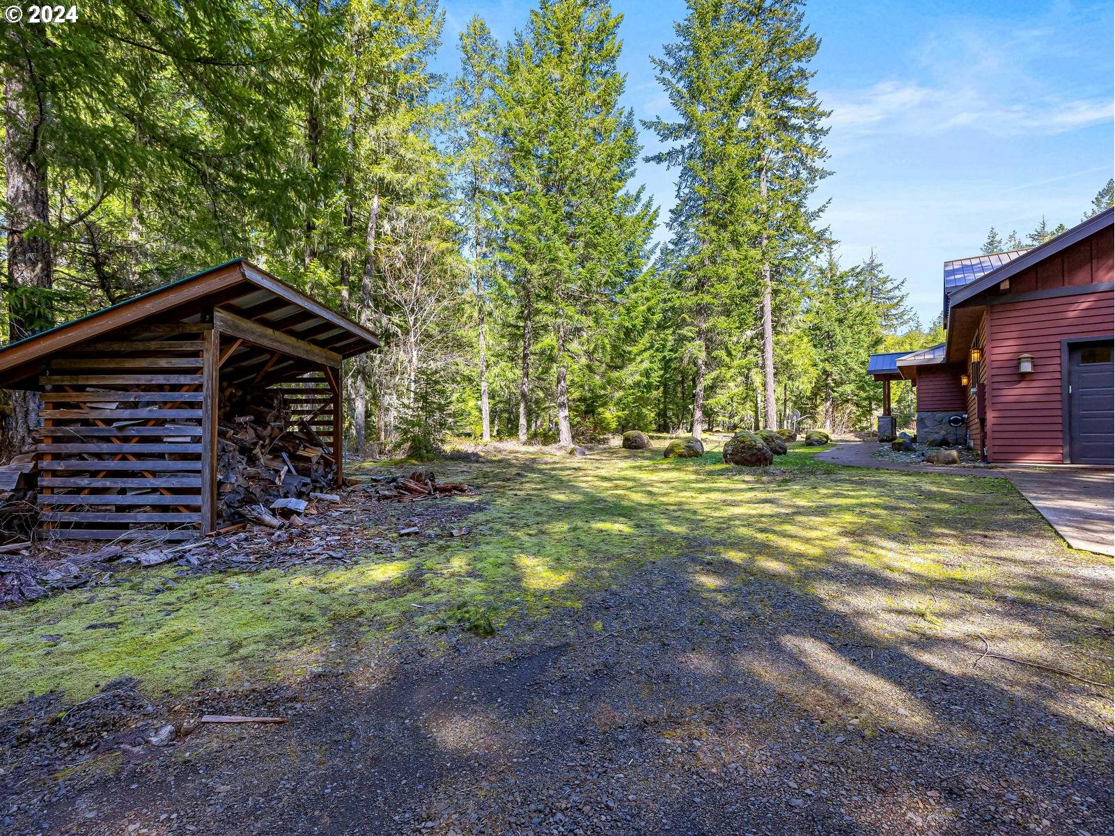 20803 East Glacier View Road Rhododendron, OR 97049 - Photo 42 of 48 a view of a house with backyard and trees