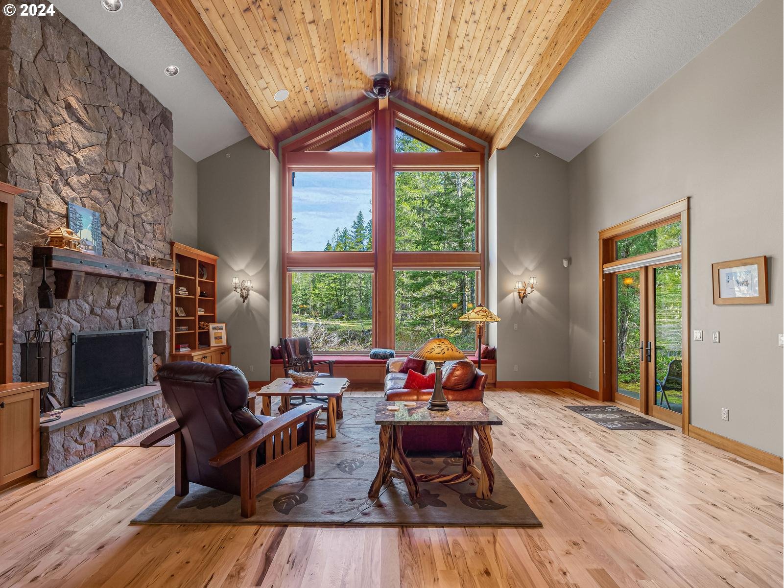 20803 East Glacier View Road Rhododendron, OR 97049 - Photo 5 of 48 a living room with furniture and a fireplace