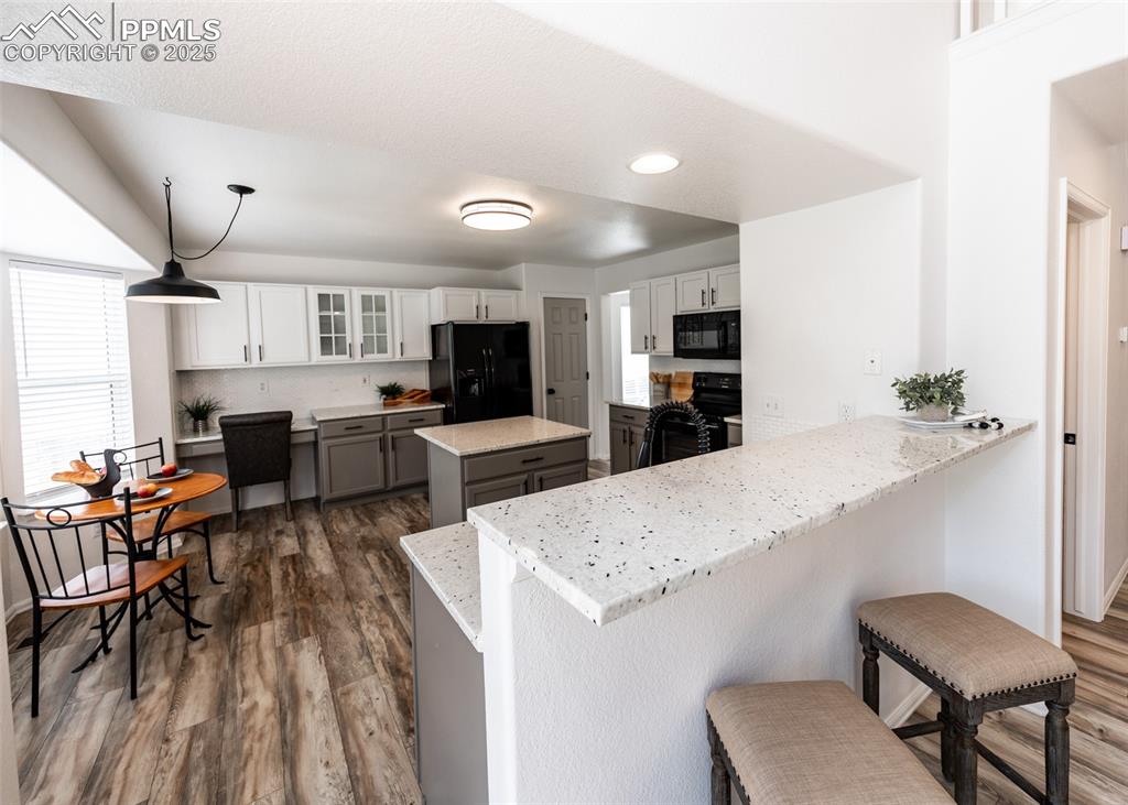 508 Fox Run Circle Colorado Springs, CO 80921 - Photo 12 of 50 a large kitchen with cabinets table and chairs