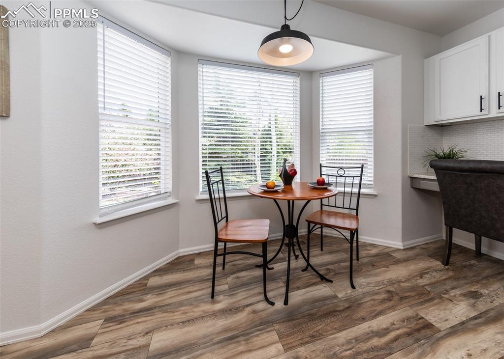 508 Fox Run Circle Colorado Springs, CO 80921 - Photo 13 of 50 a dining room with furniture and wooden floor