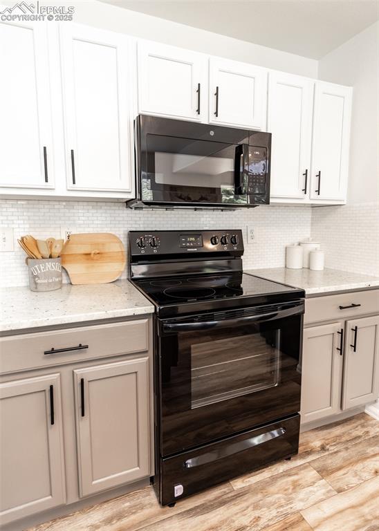 508 Fox Run Circle Colorado Springs, CO 80921 - Photo 14 of 50 a kitchen with granite countertop a stove microwave and sink