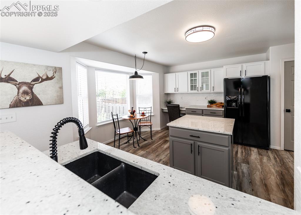 508 Fox Run Circle Colorado Springs, CO 80921 - Photo 15 of 50 a kitchen with a sink stove and refrigerator