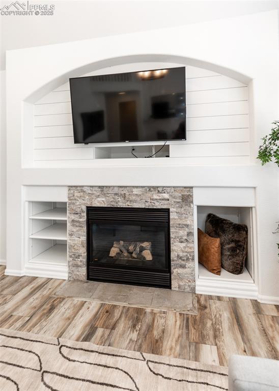 508 Fox Run Circle Colorado Springs, CO 80921 - Photo 19 of 50 a living room with a fireplace a flat screen tv and a fireplace