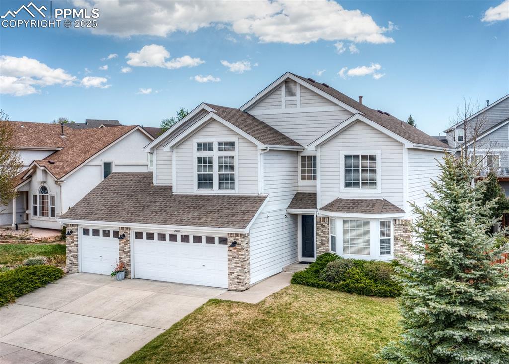 508 Fox Run Circle Colorado Springs, CO 80921 - Photo 2 of 50 a view of a house with a yard and large trees