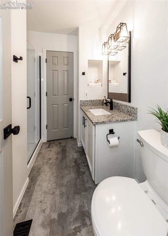 508 Fox Run Circle Colorado Springs, CO 80921 - Photo 24 of 50 a bathroom with a granite countertop sink and a mirror