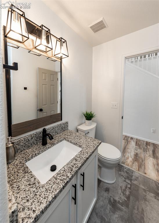 508 Fox Run Circle Colorado Springs, CO 80921 - Photo 25 of 50 a bathroom with a granite countertop sink and a mirror