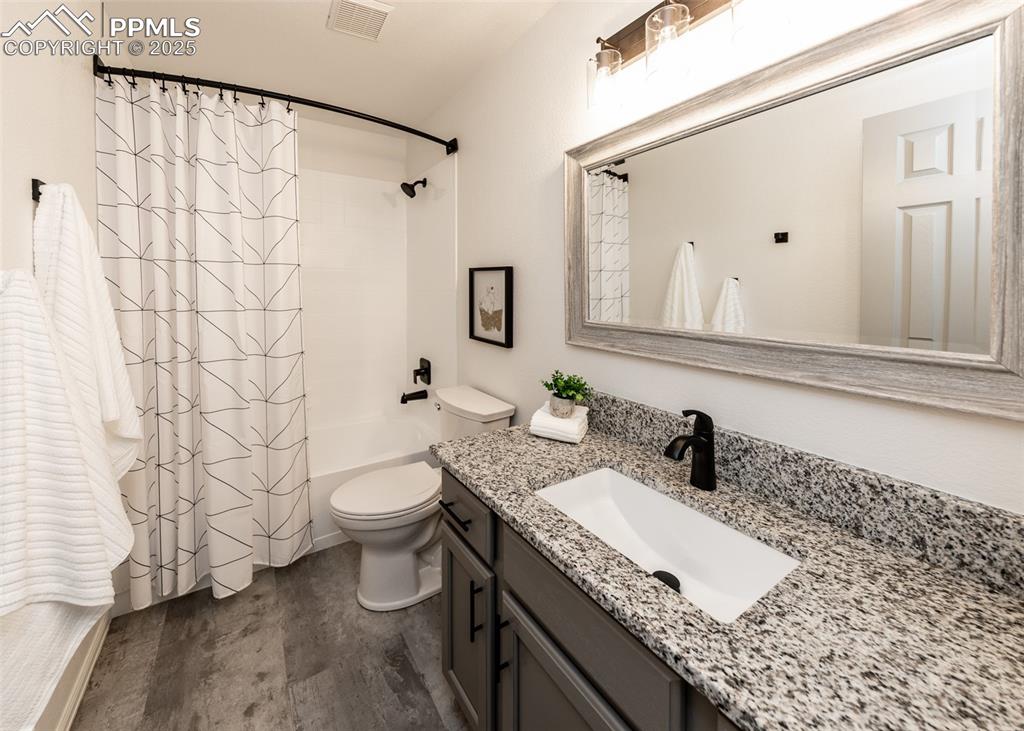 508 Fox Run Circle Colorado Springs, CO 80921 - Photo 42 of 50 a bathroom with a granite countertop sink toilet and shower