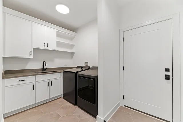 a front view of house with a garden