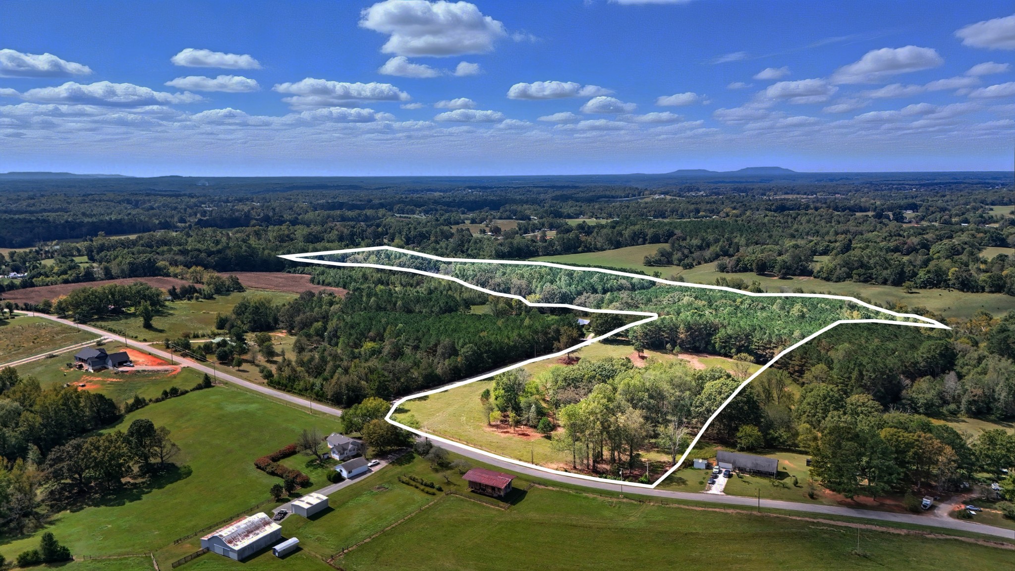 an aerial view of a house with a garden