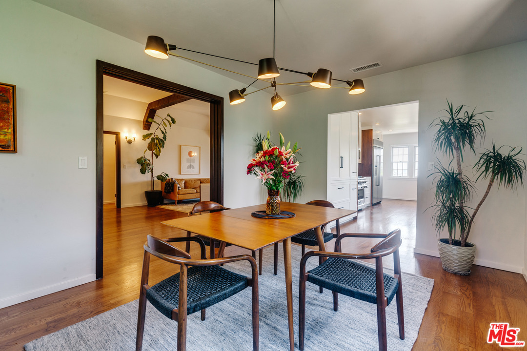 1341 Edgecliffe Drive Los Angeles, CA 90026 - Photo 15 of 51 a dining room with a table and chairs