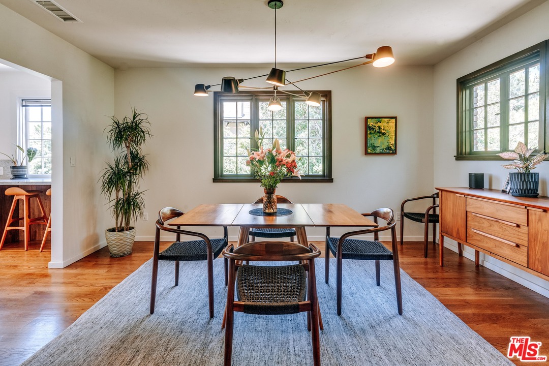 1341 Edgecliffe Drive Los Angeles, CA 90026 - Photo 16 of 51 a view of a dining room with furniture window and wooden floor