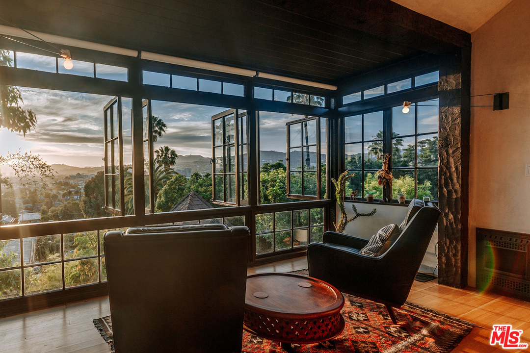 1341 Edgecliffe Drive Los Angeles, CA 90026 - Photo 3 of 51 a living room with furniture and a floor to ceiling window