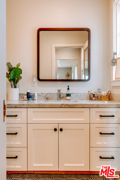 1341 Edgecliffe Drive Los Angeles, CA 90026 - Photo 24 of 51 a bathroom with sink mirror and vanity