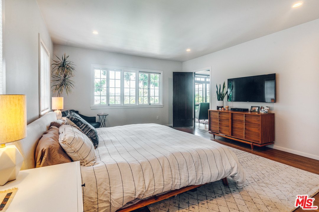 1341 Edgecliffe Drive Los Angeles, CA 90026 - Photo 25 of 51 a bedroom with a bed and a flat screen tv