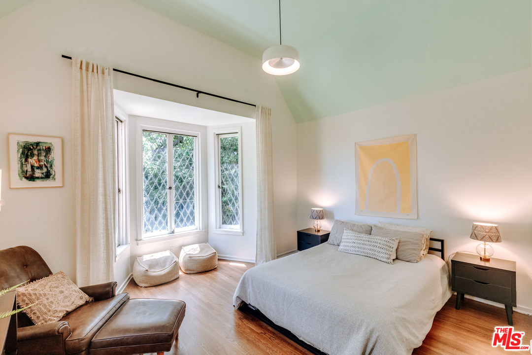 1341 Edgecliffe Drive Los Angeles, CA 90026 - Photo 27 of 51 a bedroom with a bed couch and window