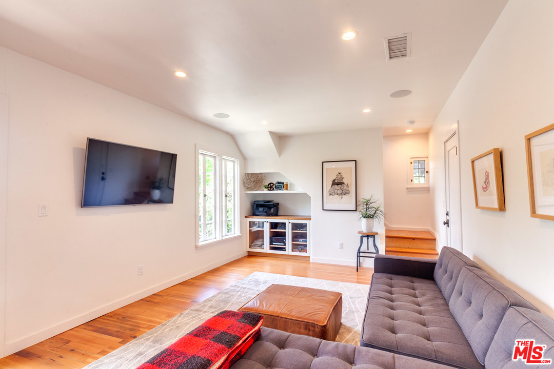 1341 Edgecliffe Drive Los Angeles, CA 90026 - Photo 32 of 51 a bedroom with furniture and a flat screen tv