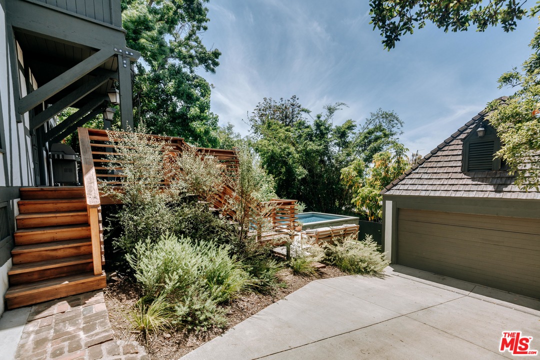 1341 Edgecliffe Drive Los Angeles, CA 90026 - Photo 38 of 51 a backyard of a house with lots of green space