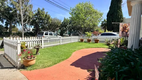 a view of a garden with an outdoor seating