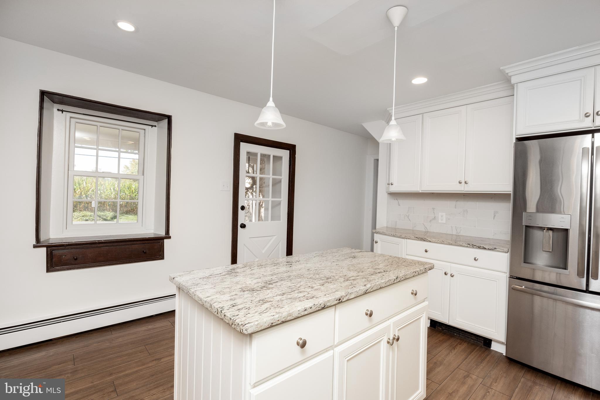 4001 Street Road Doylestown, PA 18902 - Photo 12 of 38 a kitchen with cabinets appliances and wooden floor