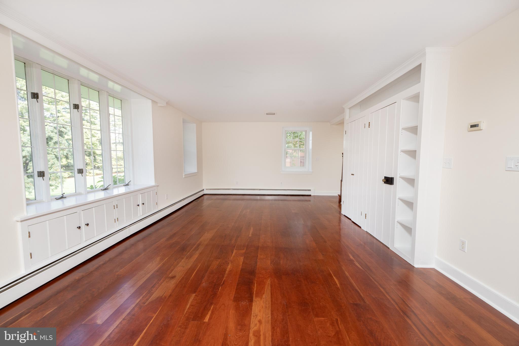 4001 Street Road Doylestown, PA 18902 - Photo 14 of 38 a view of an empty room with wooden floor and a window