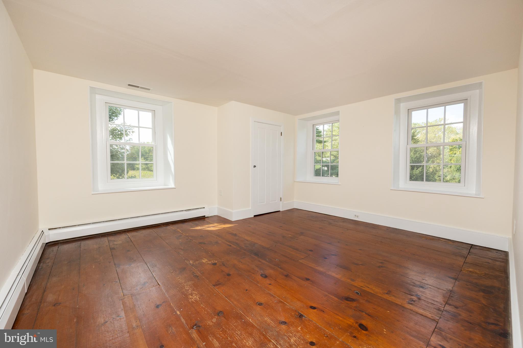 4001 Street Road Doylestown, PA 18902 - Photo 21 of 38 a view of an empty room with wooden floor and a window