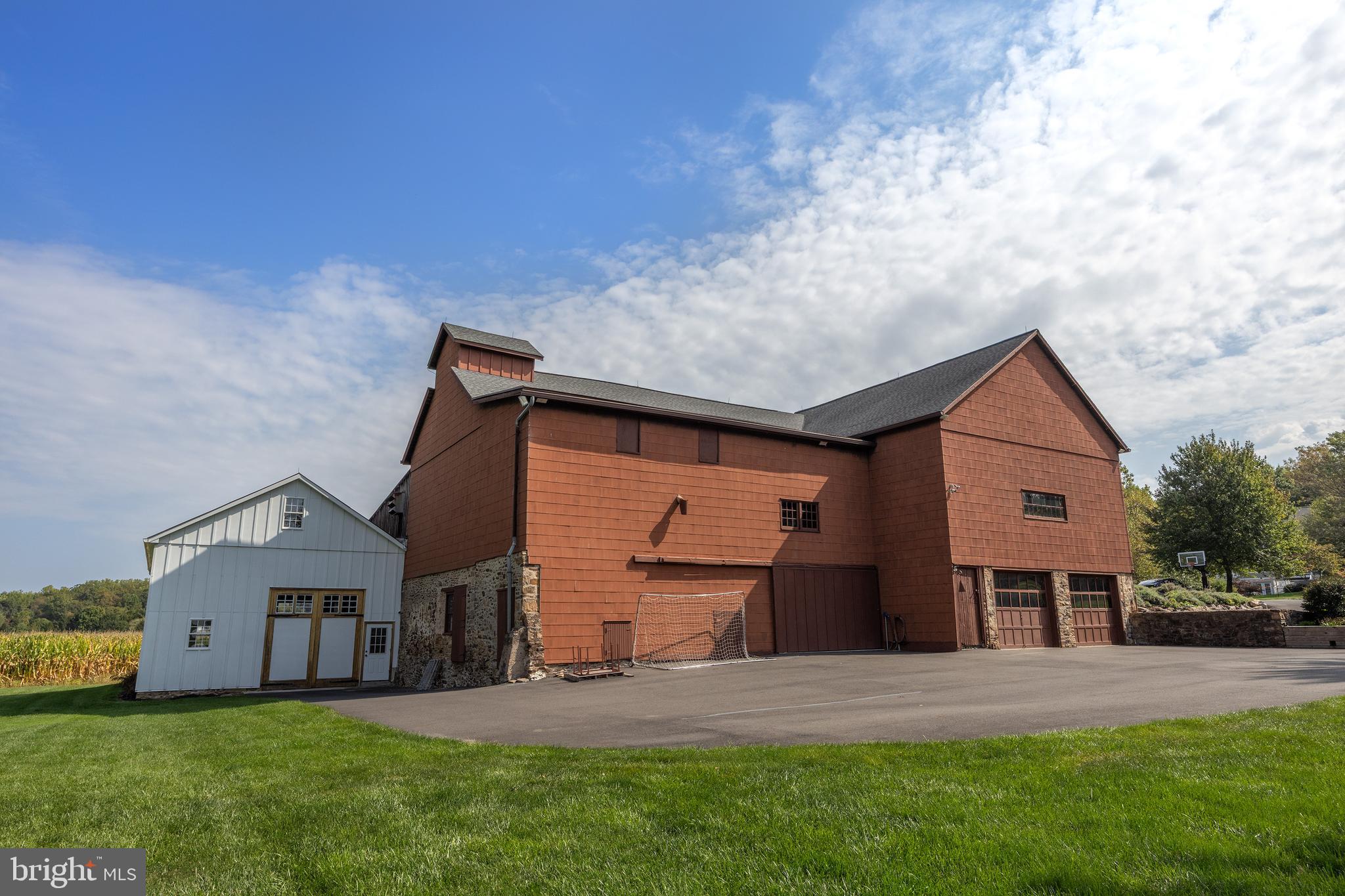 4001 Street Road Doylestown, PA 18902 - Photo 5 of 38 a front view of a house with a yard and garage