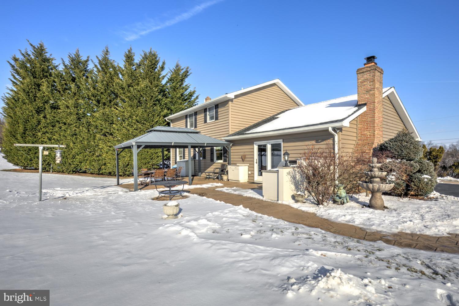1012 Rabbit Hill Road Lititz, PA 17543 - Photo 13 of 13 a view of a house with sitting area and countertop yard