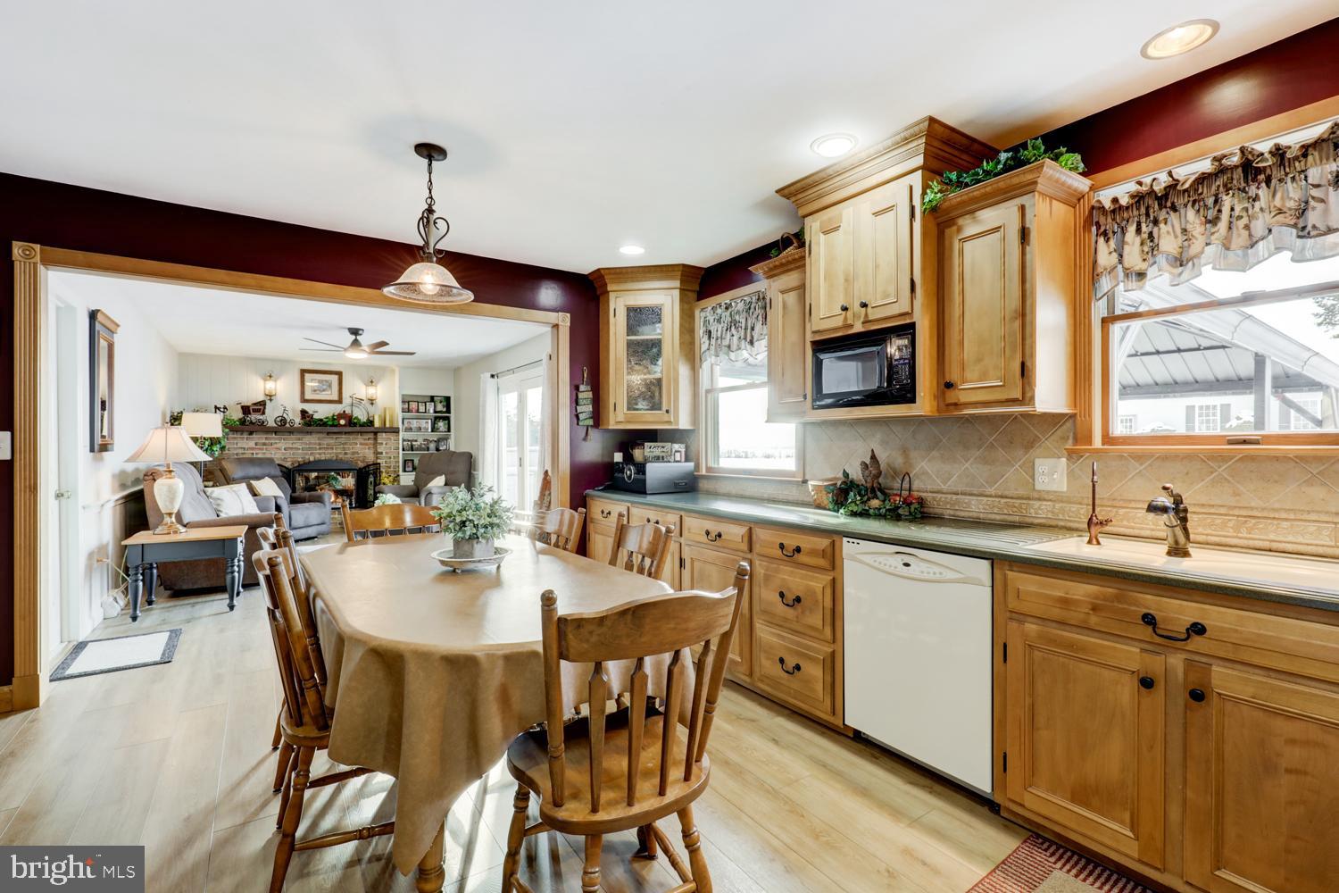 1012 Rabbit Hill Road Lititz, PA 17543 - Photo 4 of 13 a kitchen with a dining table chairs sink and cabinets