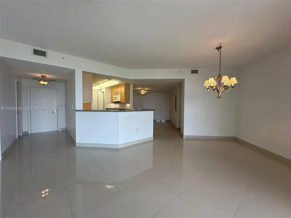 a kitchen with granite countertop sink stainless steel appliances a window and a counter top space