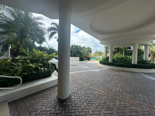 a view of a hallway with seating area