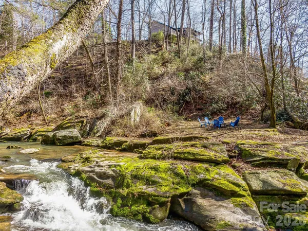 a view of a backyard with sitting area