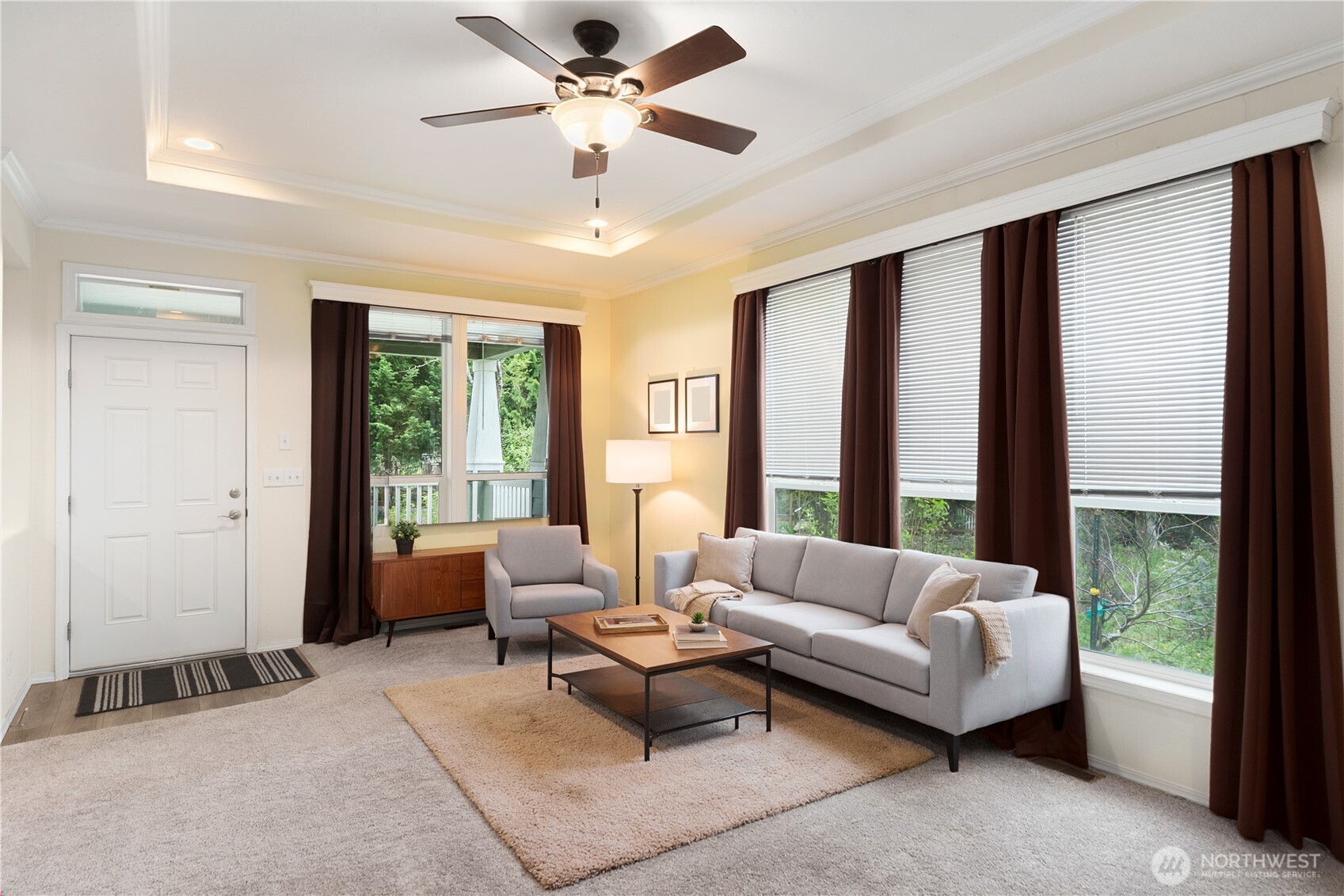 290 Werner Road Port Ludlow, WA 98365 - Photo 10 of 40 a living room with furniture and a large window with garden view