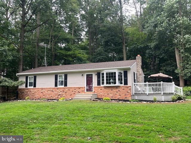 157 Leppo Road Westminster, MD 21158 - Photo 2 of 6 a front view of house with yard and green space