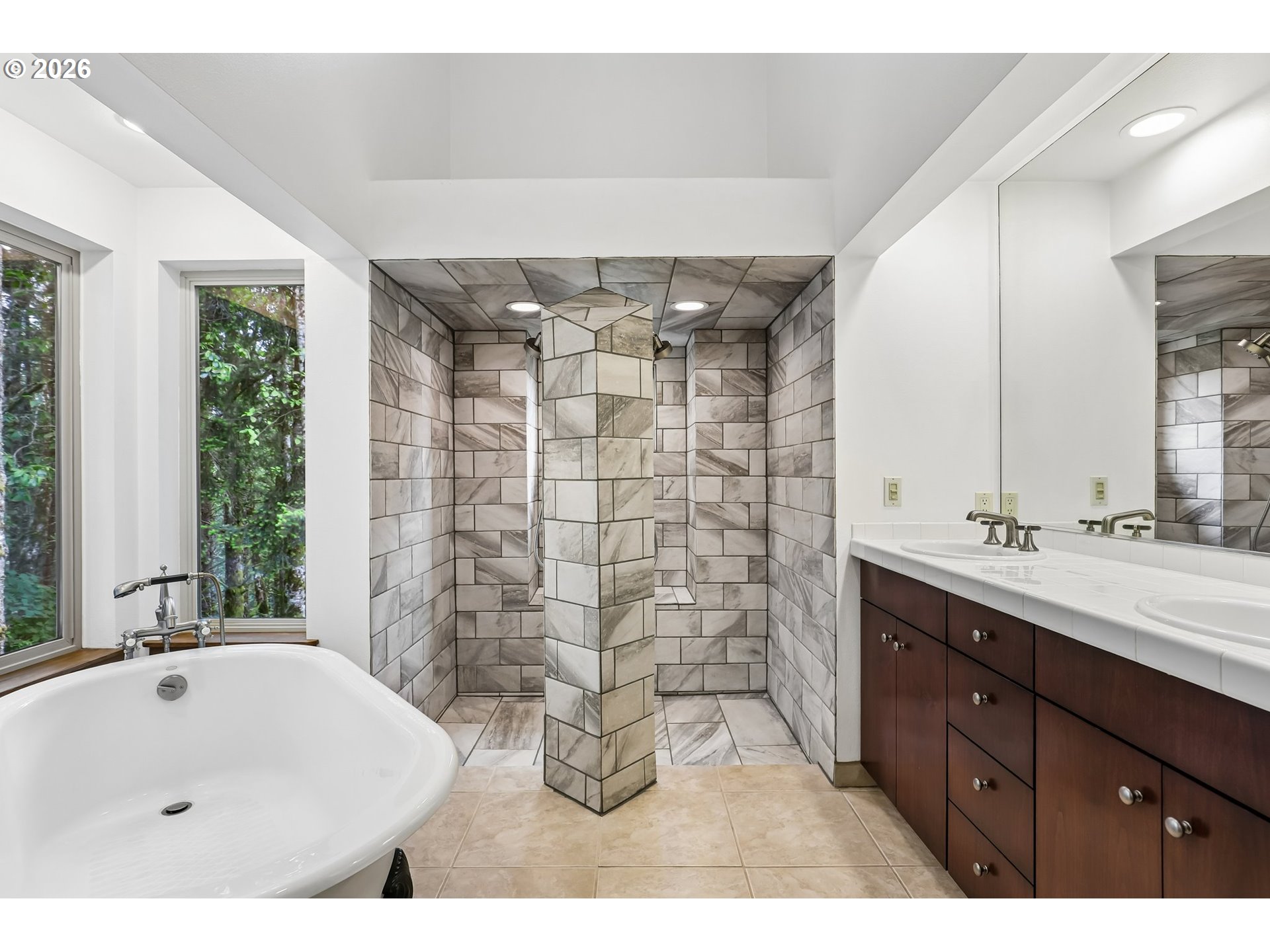 873 Mountain View Road Kalama, WA 98625 - Photo 25 of 45 a bathroom with a sink double vanity and a shower