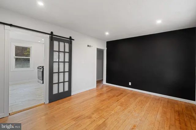 a view of an empty room with windows