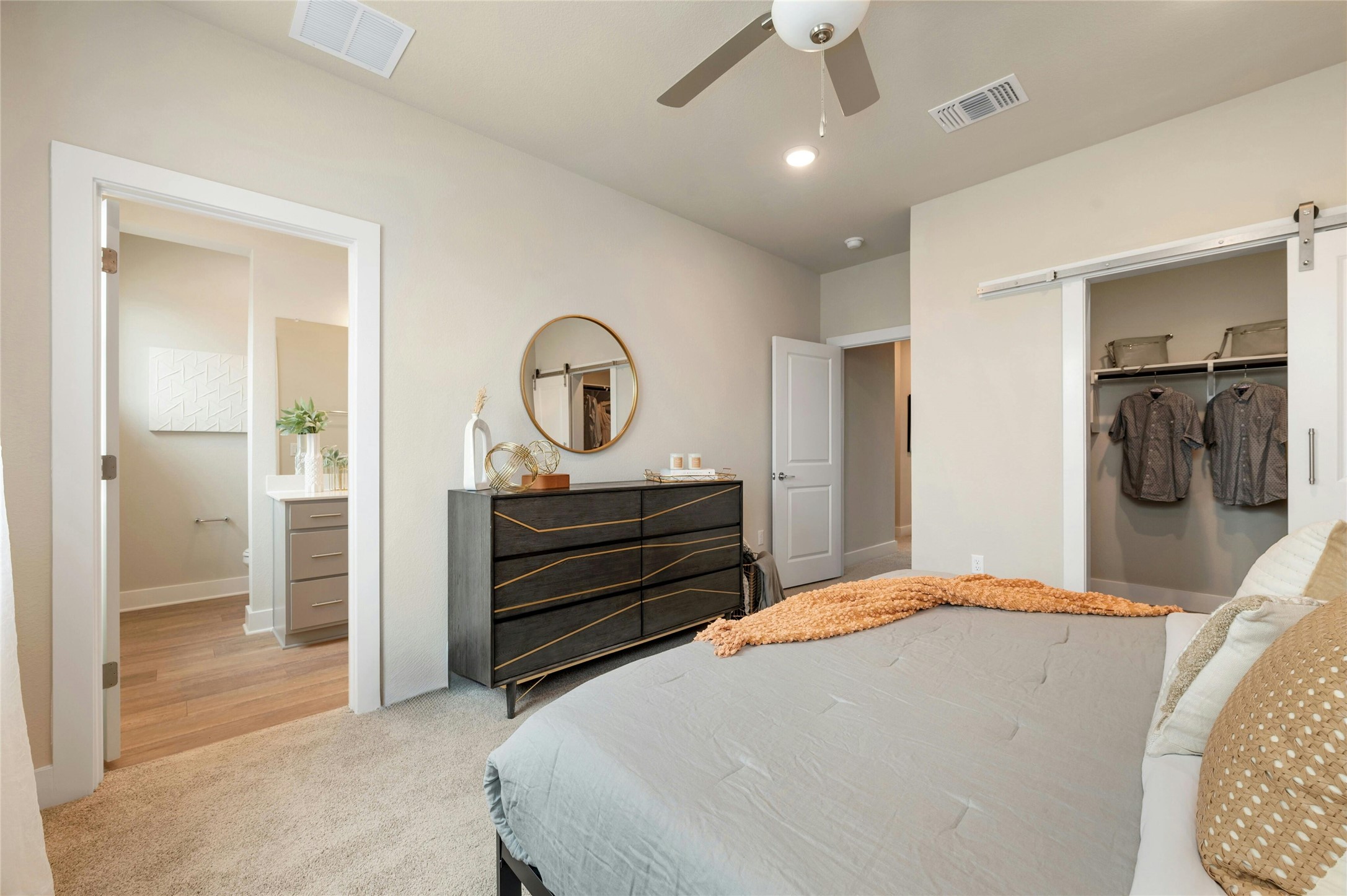 5804 Rotunda View Austin, TX 78747 - Photo 13 of 27 Unwind in this spacious bedroom, offering plush carpeting and seamless access to a well-appointed bathroom.