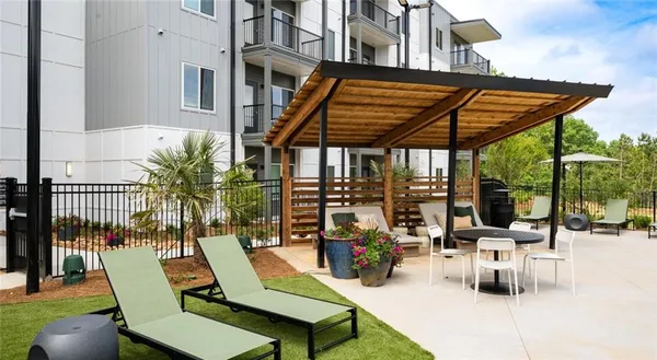 a view of backyard with wheel chair and potted plants