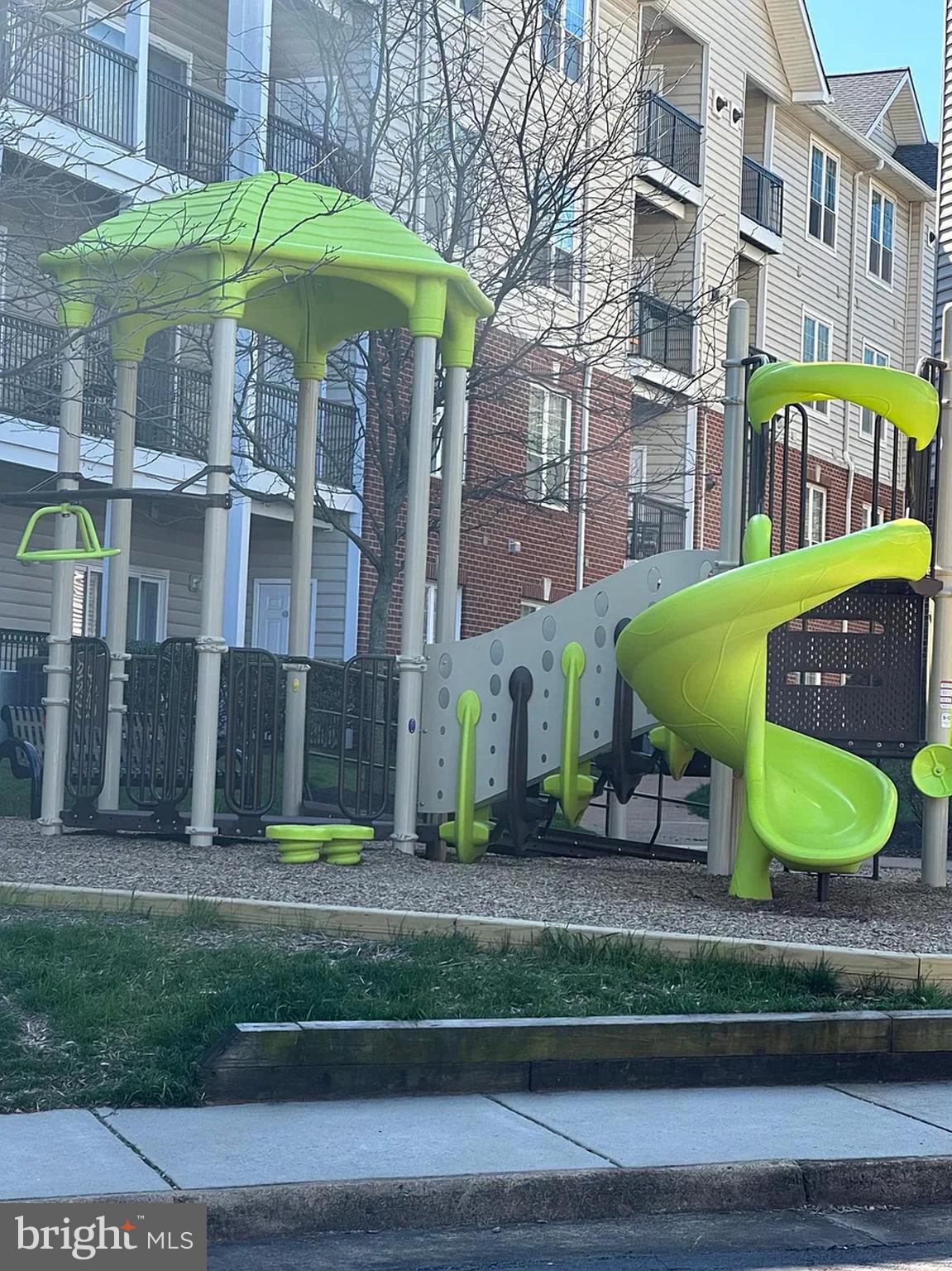 1580 Spring Gate Dr., Unit 4314 McLean, VA 22102 - Photo 23 of 36 a front view of a building with garden