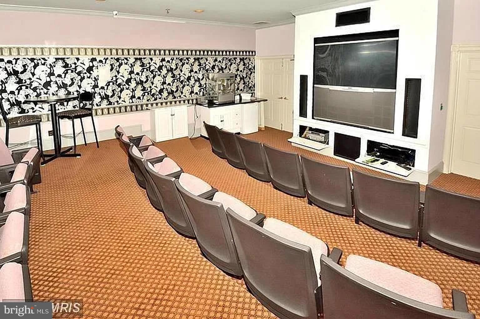 1580 Spring Gate Dr., Unit 4314 McLean, VA 22102 - Photo 27 of 36 a living room with a couch and a flat screen tv