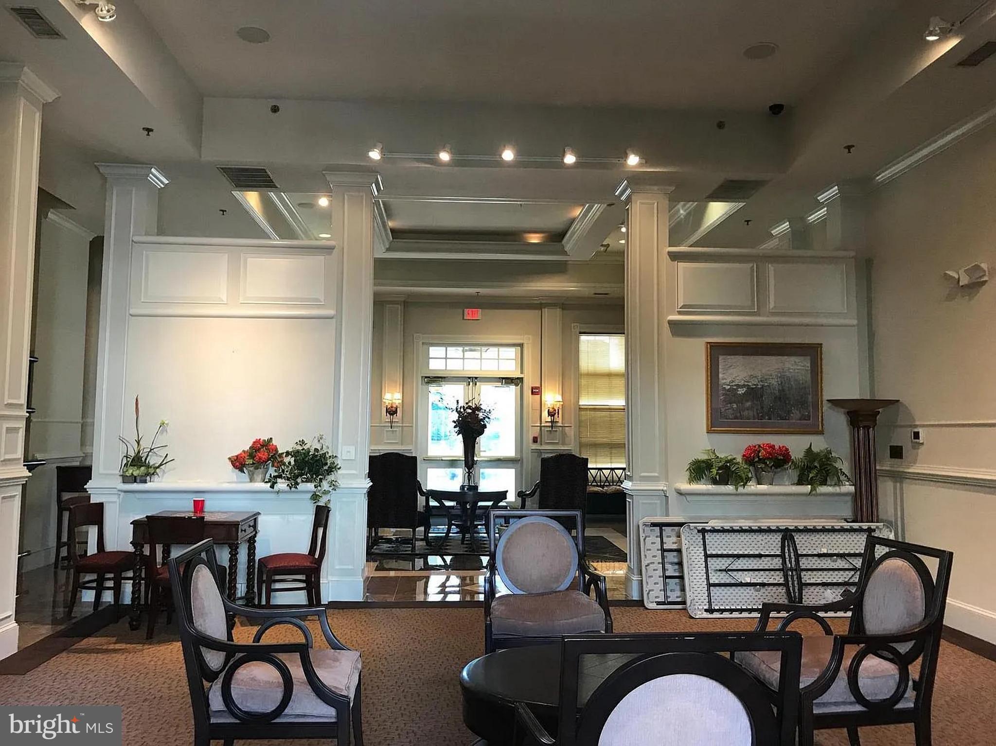 1580 Spring Gate Dr., Unit 4314 McLean, VA 22102 - Photo 29 of 36 a living room with furniture and kitchen view