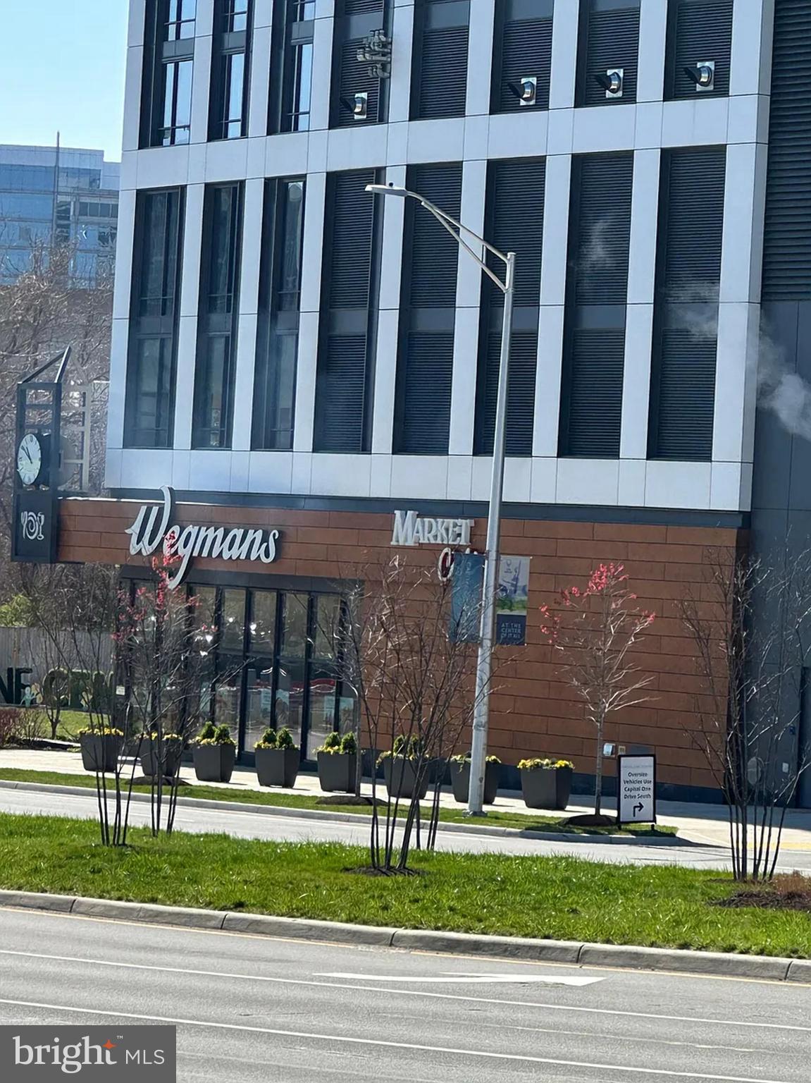 1580 Spring Gate Dr., Unit 4314 McLean, VA 22102 - Photo 33 of 36 a view of a building with a yard