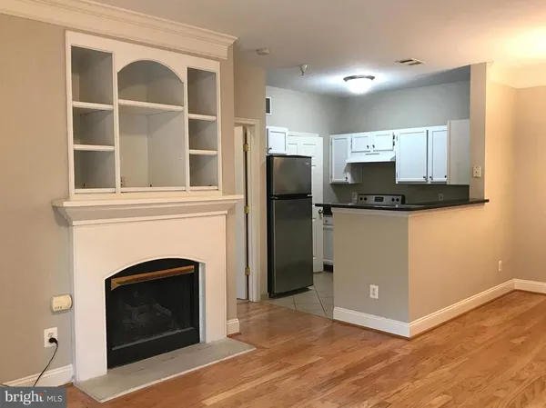 a view of a livingroom with a fireplace and television