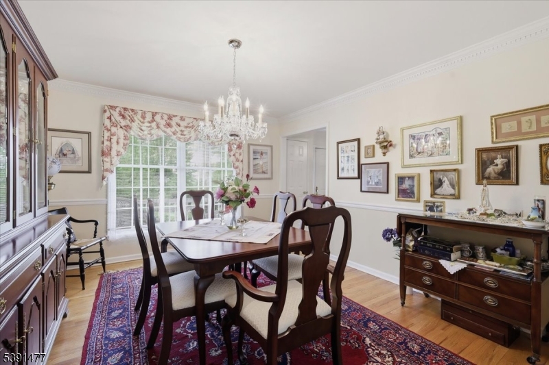 42 Copper Penny Road Flemington, NJ 08822 - Photo 17 of 39 a view of a dining room with furniture and chandelier