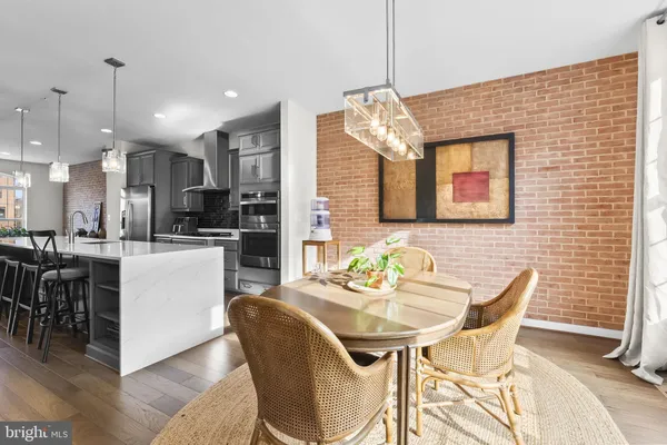 a dinning room and kitchen with a table or chairs