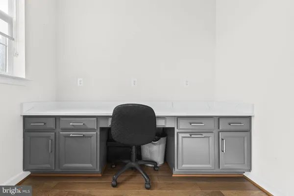 a view of a workspace with furniture