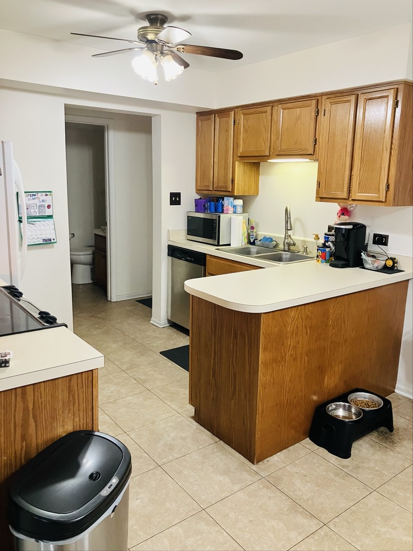 3524 Willowview Court Aurora, IL 60504 - Photo 2 of 12 a kitchen with a cabinets a sink and a stove