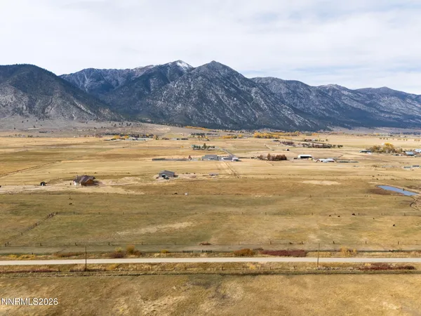 a view of an ocean and a mountain