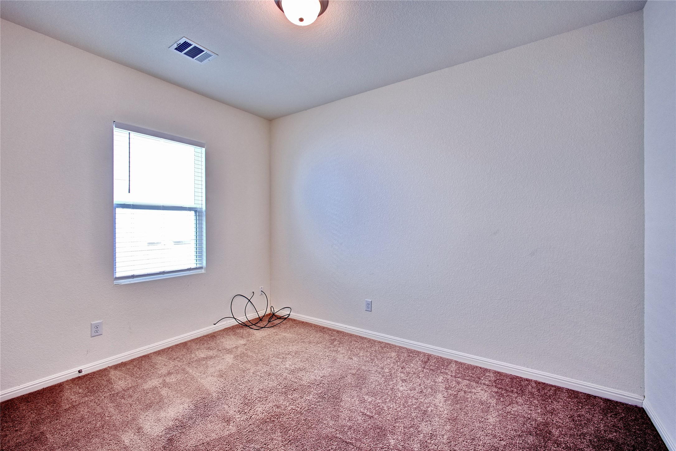 125 Woodpecker Run Jarrell, TX 76537 - Photo 18 of 22 an empty room with a window