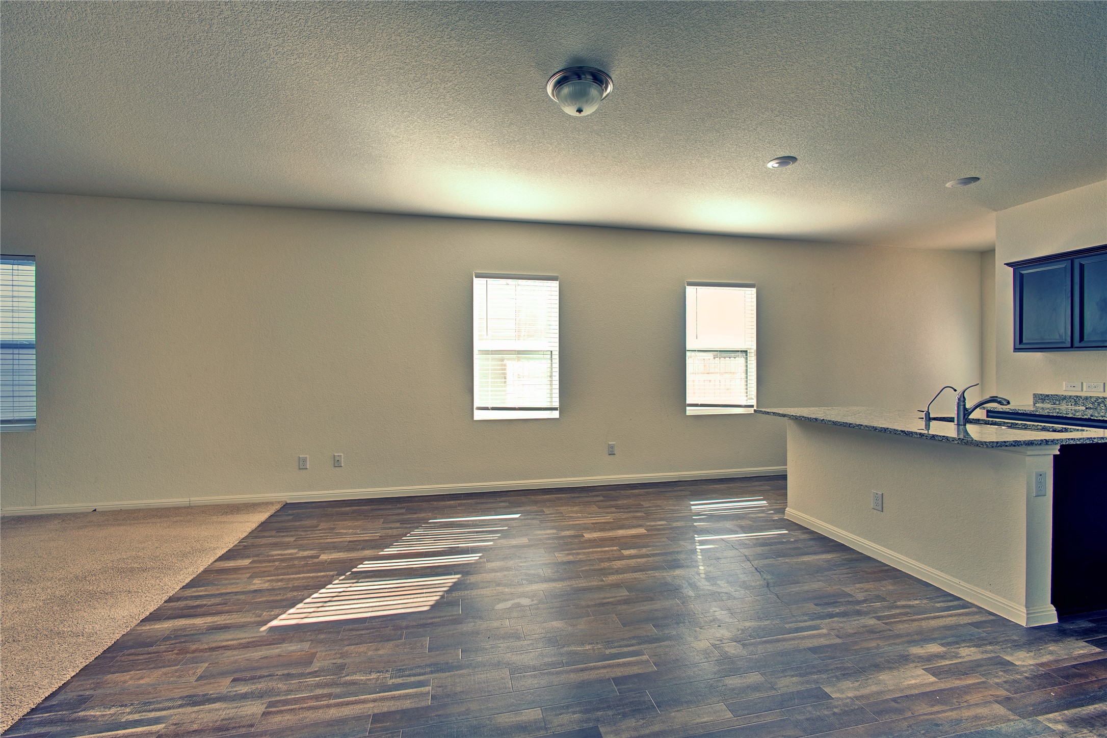 125 Woodpecker Run Jarrell, TX 76537 - Photo 6 of 22 an empty room with wooden floor and windows