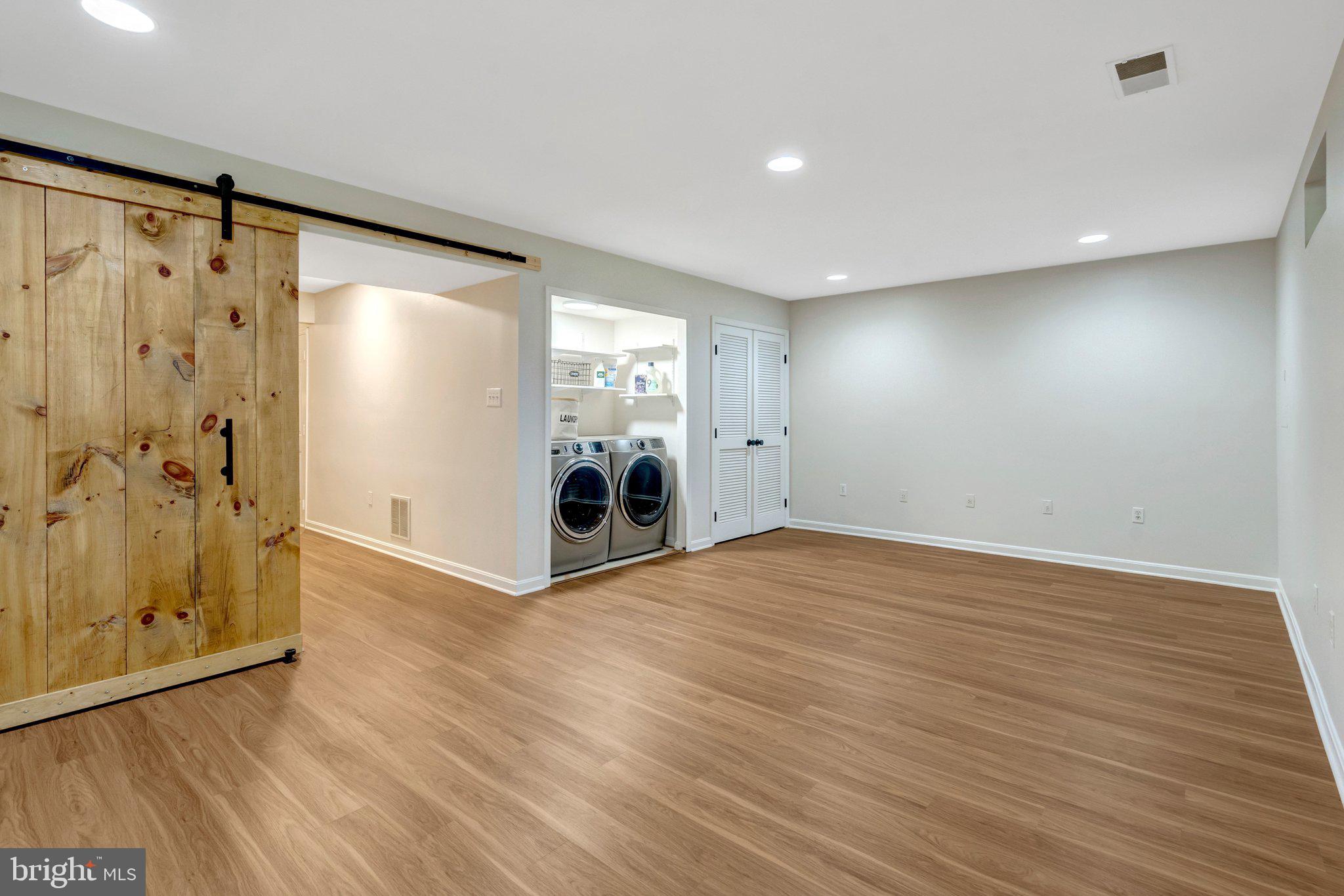 7706 Shadowcreek Terrace Springfield, VA 22153 - Photo 27 of 30 a view of an empty room with wooden floor and a window